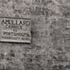 The sign reads 'A Mullard, Carrier to Portsmouth'. His competitor, Noble White, lived just 100 yards down the High Street.