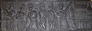 Adam and Eve are expelled from the Garden of Eden. On the right, Eve is taught to spin and Adam to dig.
