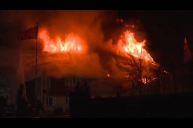 A second image of the thatch of Brook Cotttages ablaze