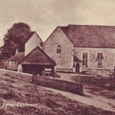 The Court House as a working farm, as also seen in the Bryden engraving. It shows a cart in a separate shelter, a grain store, raised on saddle stones, and a porch at the foot of stairs up to the upper chamber. These buildings were removed when Morley Horder restored The Court House.