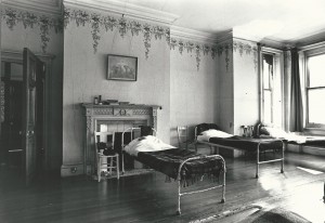 Dormitory at Wesbury House, with original wallpaper from re-building after the fire in 1904.