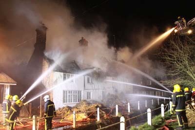 Once again, numerous fire brigades arrived to control the flames. They were too late to save Hockley (the white building nearer the camera) or Brook Cottages