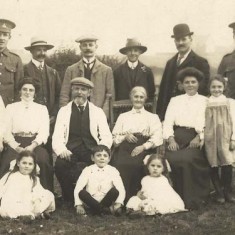 Family group, WWI uniforms? reduced Family Group with two men in army uniforms (WWI?)