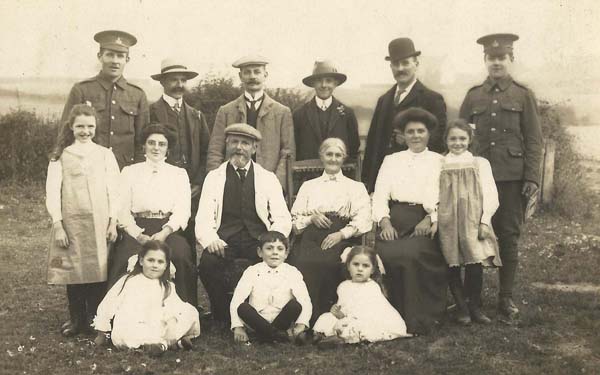 Family Group with two men in army uniforms (WWI?)
