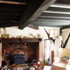 Sitting room with inglenook fireplace (likely to have been installed in the 17th century).