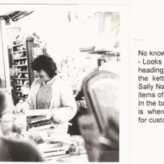 Jean Emptage leaving, with Sally Nash behind - wool can be seen in the shelves behind