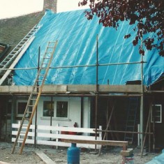 Kitchen roof under tarpaulin during alterations