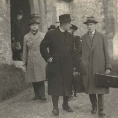 Major Gerald Nicholson, right, outside All Saints Church with visiting bishop. Nicholson  used to walk to church every Sunday, and back via Colchenna where he talked with Ernest Noyce.
