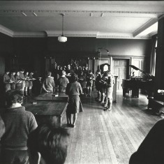 The school at morning prayers in the organ room.