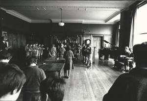 The school at morning prayers in the organ room.