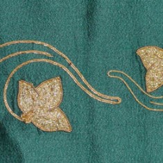 Part of Top Border_1 Some undertook ambitious styles of needlework, including Shirley Whiting who used classic embroidery for the border and Cathy herself who did the gold work in the top panel (above) and the corners. Some trees were executed using water-soluble plastic on a sewing machine