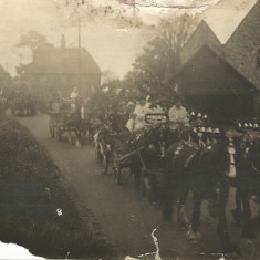 Early photo of procession passing between Court Farm and All Saints.