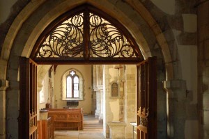 Woodwork over the doorway to the Lady Chapel, also the design of Ninian Compler