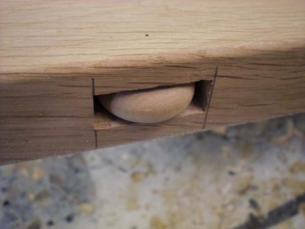 Toy wheels, hidden, to reduce friction of drawer locking mechanism