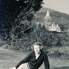 Olivia Olivia Woodfield on the lawn at The Tudor House, with a clear view of All Saints' spire behind.