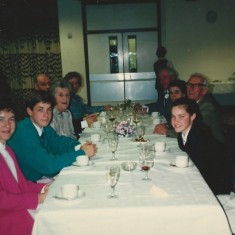 Reg Files (on right, with grey hair, leaning back) with villagers at Village Hall event
