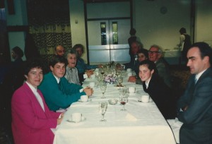 Reg Files (on right, with grey hair, leaning back) with villagers at Village Hall event