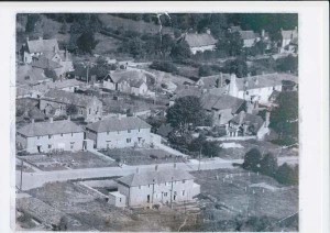 Post-war photograph of Glenthorne Meadow, with council houses partially built. Julie Pindell can be seen on the doorstep of No 18. The Institute can be seen in the top left corner,