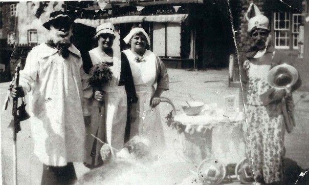 Group (helpers?) in fancy dress.
