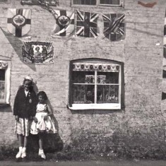 Pamela and Carole & bunting Pamela and Carole with coronation bunting.