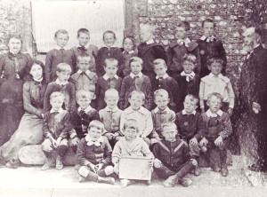 Schoolchildren with William Tregear, on the right, and assistant teachers Ada Hovell and Frida Kille.