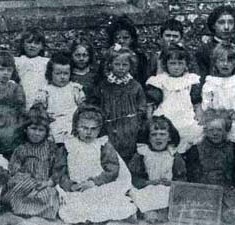 Schoolgirls c 1900. Back row, left to right: Isabel Budd, Miriam Nash, Mabel Pollard, May Kille, Dorothy Kille, Winnie Moody, assistant teacher Frida Kille. Middle row, Unknown, Lily WIlks, Kate Blackman, Nancy Micklam, Winnie Smith, Miriam Sawyer, Ellen Chivers. Front row: Beatrice Parfit, Emily Nicholson, Nellie Hockley, Rose Nicholson, Annie Moon, Nellie Moon.