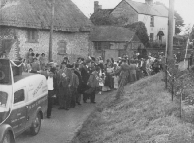 Coronation Procession coming down the High Street, by Riverside/