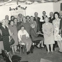 Group with bunting in Institute, undated.
