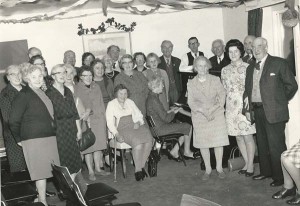 Group with bunting in Institute, undated.