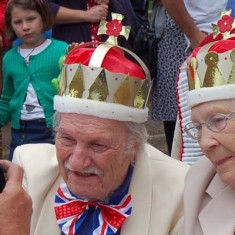 Jubilee king and queen have their picture taken for the local paper.