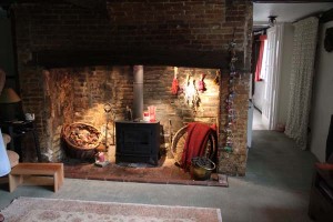 Fireplace and stove Kitchen side of Fireplace, with bread oven inset into side wall.