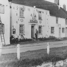 Man on doorstep of Barnards