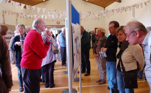 Visitors examining the House History screens.