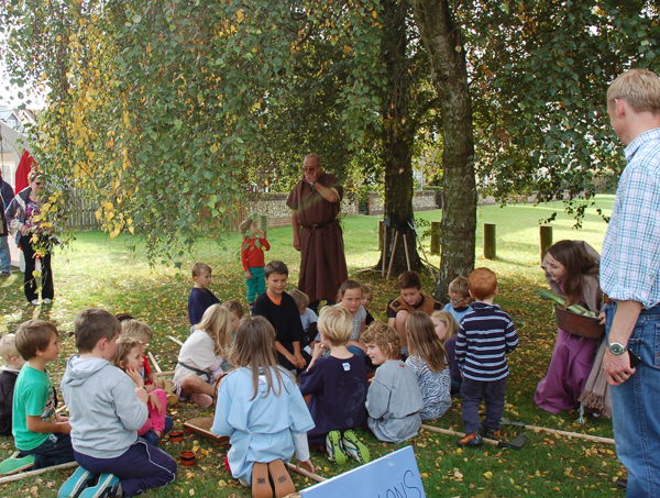 Saxon farmers preparing to eat.