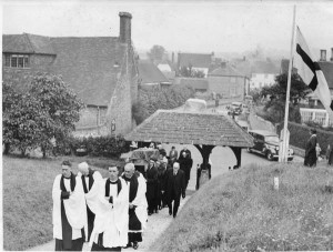 The Rev Saunders (left) leading funeral procession