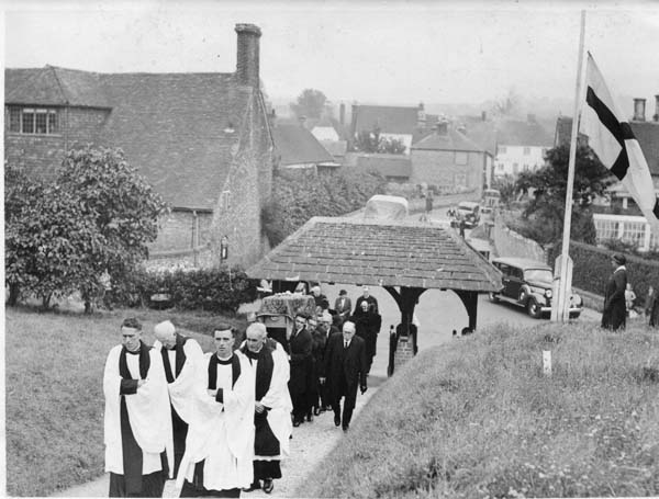 The Rev Saunders (left) leading funeral procession