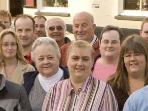 This is my Grandad Harold. (In dark glasses). Everyone calls him ‘Nobby’. He was born in 1948 and went to the ‘Old School’ on the Hill. He remembers that his headmistress Mrs Hayes kept her hanky tucked into her knicker leg. Everyone took turns to be dinner monitors, and when the milk was delivered in the  morning, it was kept warm by the stove until first break. 