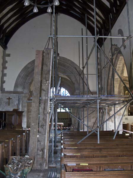 Aisle with scaffolding and planks