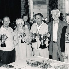 Garden Club Annual Show in Village hall, cup winners. On left, Admiral Dennis Mason, on right, Paddy Mason and Jane Atkinson. 