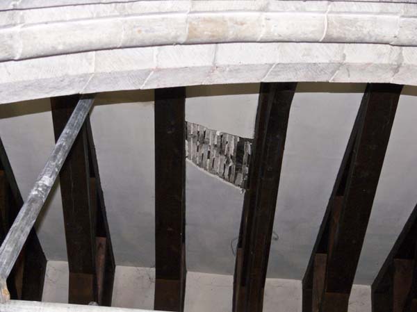 Hole in ceiling with lathes