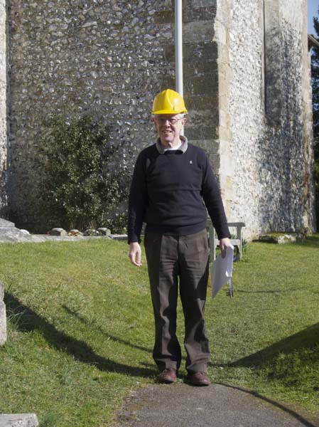Martin Harbord with hard hat and papers 