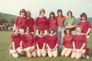Women's soccer team, with Peter Marinelli. Left to right, Sharon Brown, Pat Elliott, Julie Cannings, Diane Adams, P.M., Fiona Tindell, Joan Blackman, front row, Mary Crockford, Joyce Colbourne, Dawn Adams, Brenda Kirby, Mrs Whiteley and Julie Goddard. Pam Sparrow also played, but took the photo.