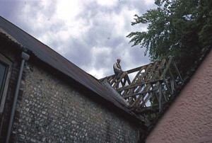 Denys sawing one of the rafters as part of the reconstruction of Frogmore Mill
