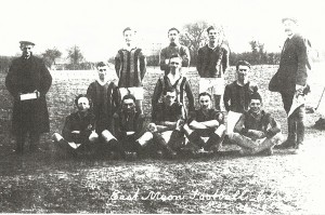 Early team. Goalie Caleb Kille, L. Back W. Nicholson, Ctr Half, P.C.Parminter, L Half, Bill Budd, Outside right Dido Moore, Inside Right, Chris Budd, Ctr Forward Joe Atkinson, Outside Left, Darkie Nicholson. With box, Mr Crockford, With flag, Mr Flux