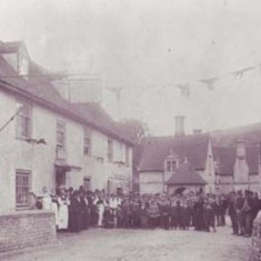 Gathering outside George Inn Staff and villagers gather outside the George Inn at a celebration, possibly Queen Victoria's Jubilee in 1887.