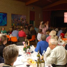 Race  night in Village Hall, fundraising for Cricket Club. Wilson Atkinson on R.