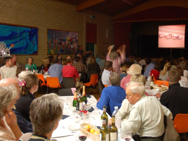 Race  night in Village Hall, fundraising for Cricket Club. Wilson Atkinson on R.