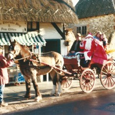 Cart with Fr Xmas outside Riverside Stores and Post Office