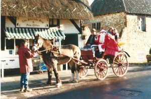 Cart with Fr Xmas outside Riverside Stores and Post Office