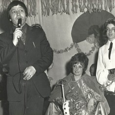 John Sparow announces Jenny Wheeler as Queen, with attendant Diana Adams